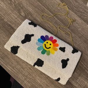 Cow print beaded clutch